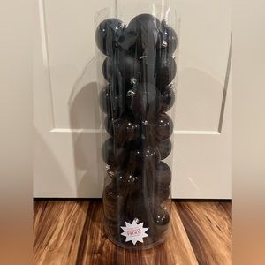 Large pack of black Christmas ornaments